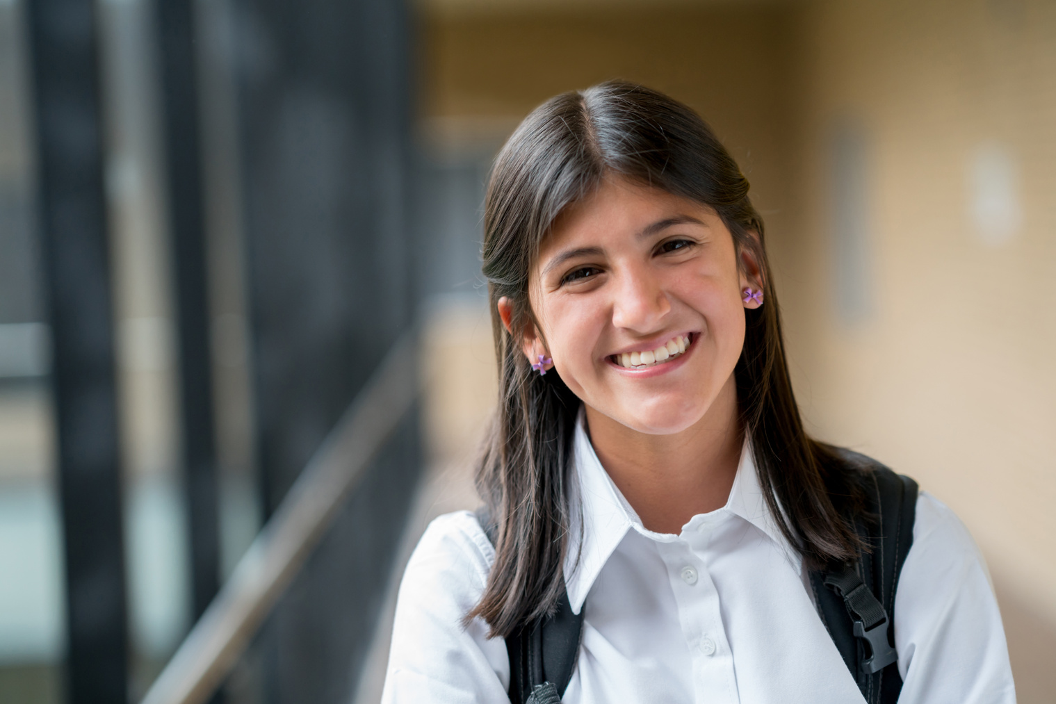 Happy Latin American student at school