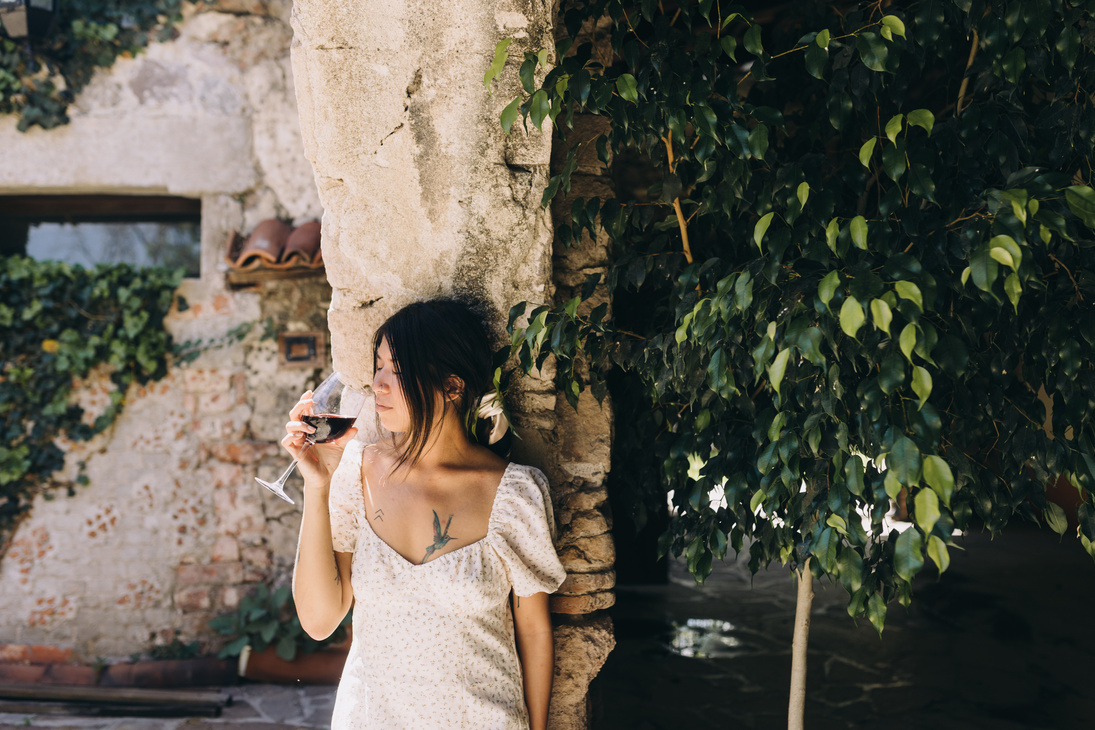 Woman Drinking a Glass of Wine Outdoors