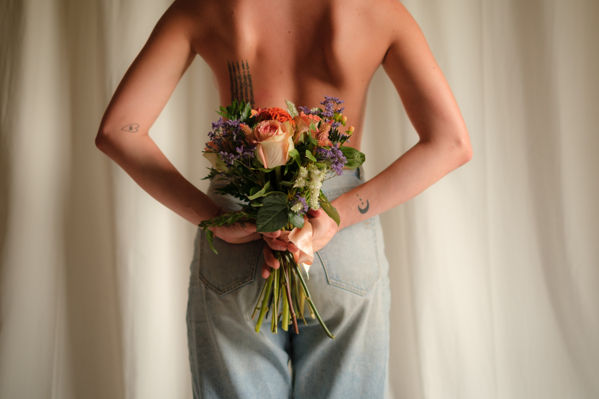 Bouquet at the Back of a Topless woman