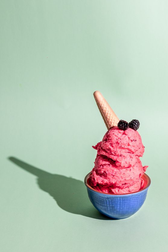 Bowl of Bright Pink Ice Cream with Wafer Cone