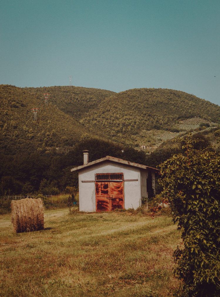 Hay Bale Outside a Farm Shed 