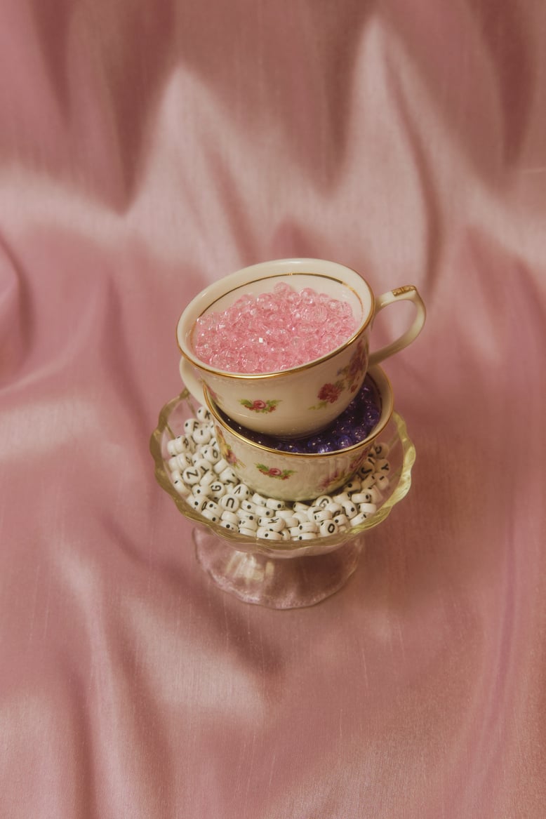 Cups with Beads on Pink Fabric