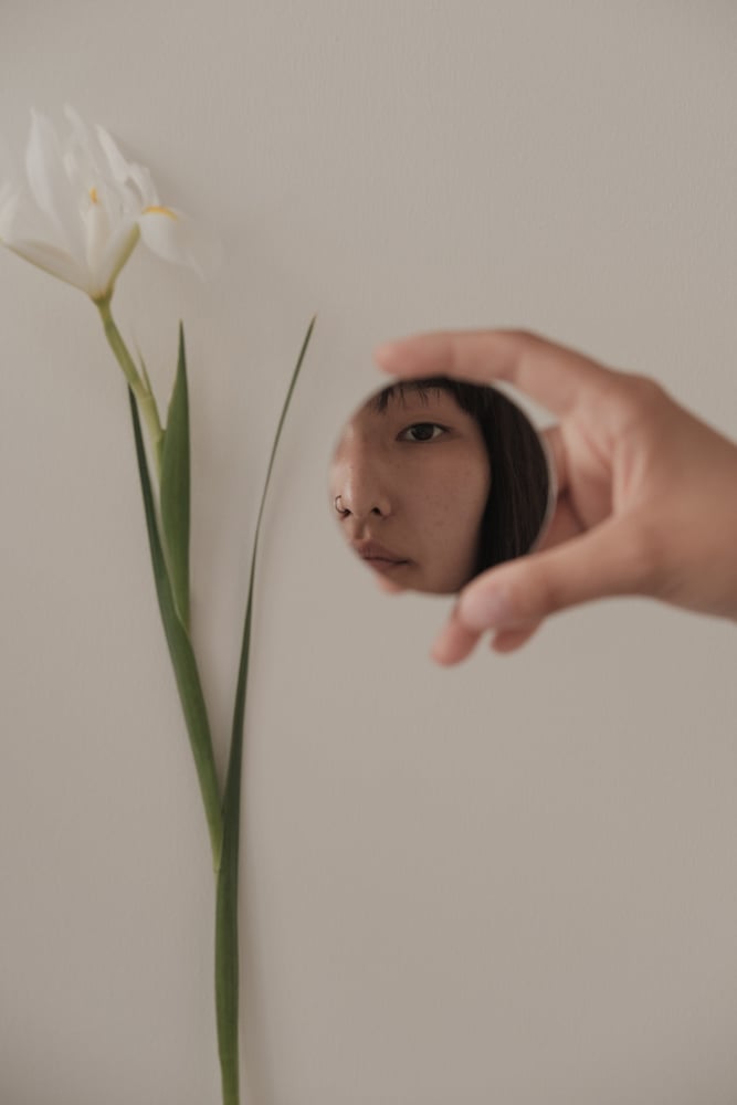 Hand with Small Round Mirror