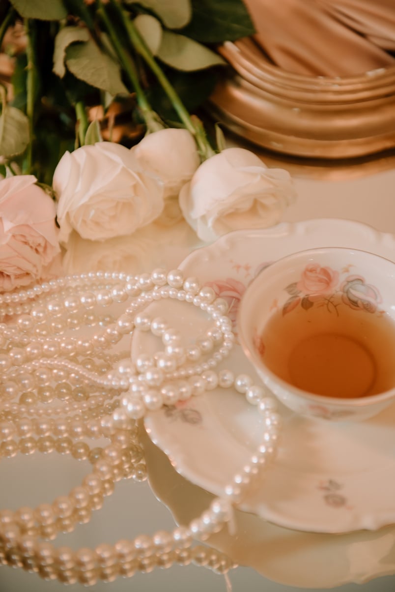 Cup of Tea, Flowers, and Pearl Necklaces