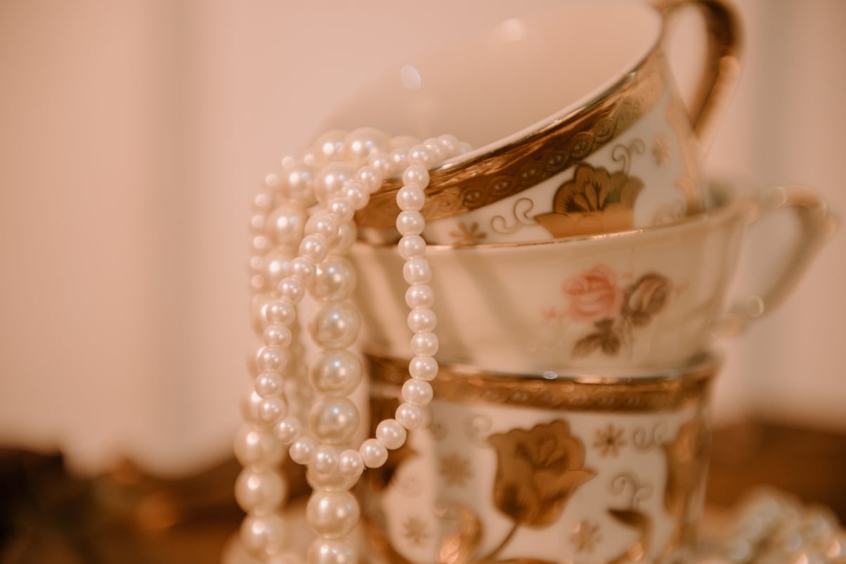 Stack of Vintage Teacups with Pearl Jewelries