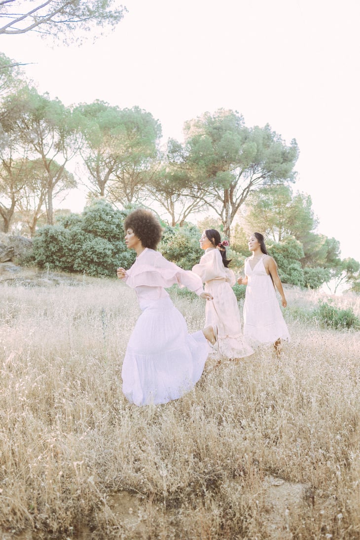 Three Diverse Women Running in the Field