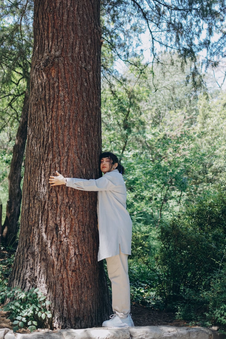 Woman Hugging a Tree