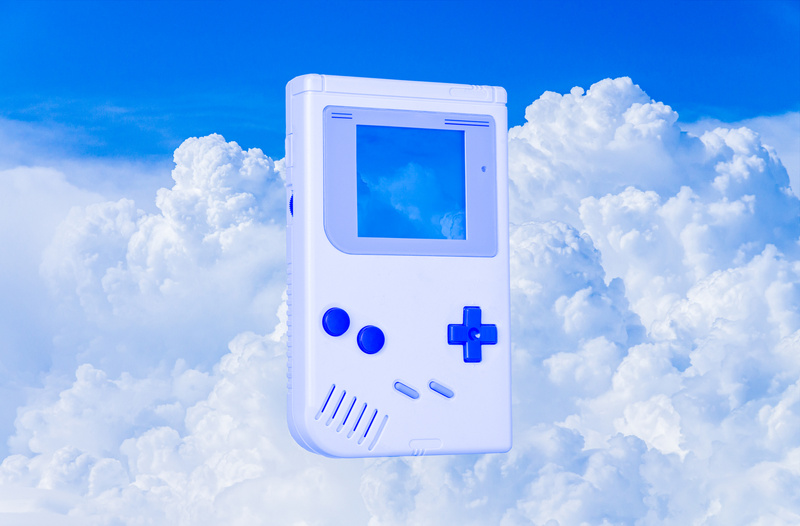 Gameboy on Clouds Background