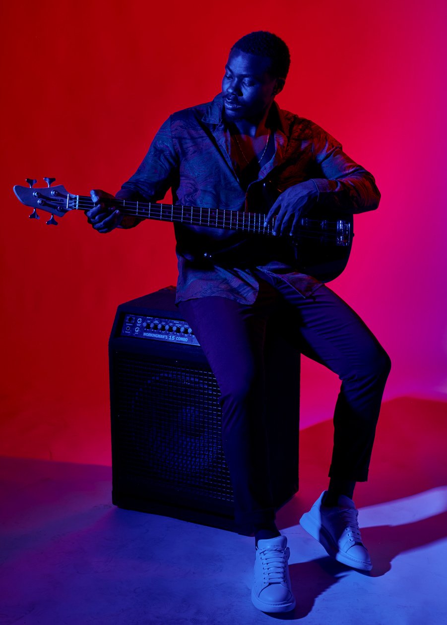 Guitarist Sitting on the Speaker 