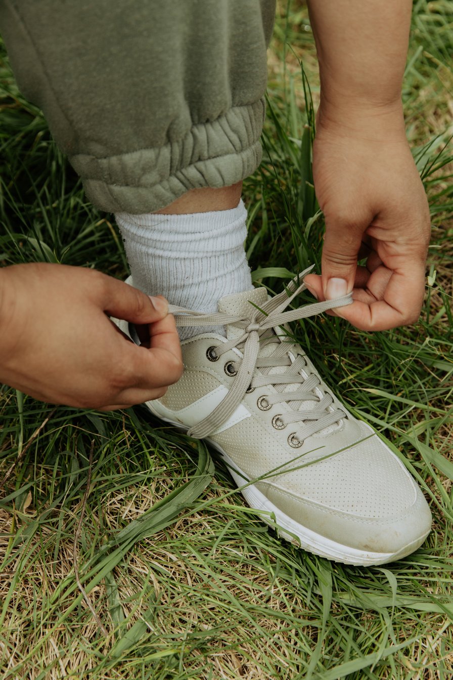 Woman Tying Shoelaces