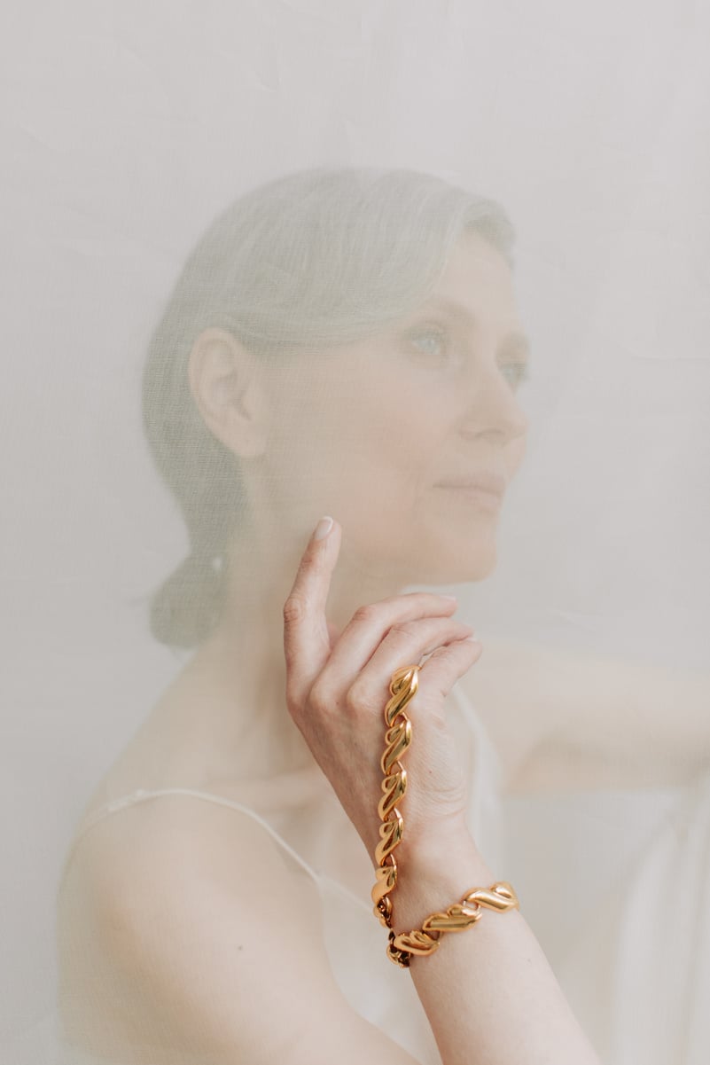 Portrait of Senior Woman Wearing Gold Bracelet