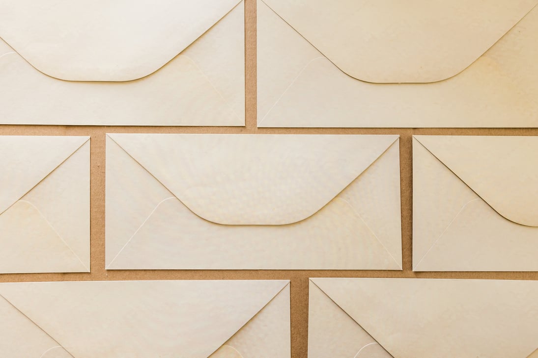 Envelopes Laid Out on Brown Background