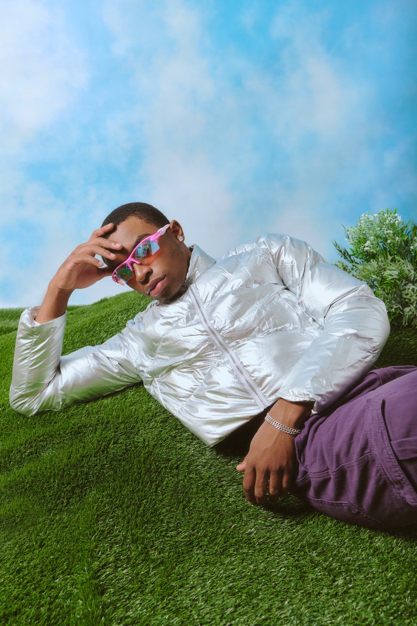 Fashionable Young Man Lying on the Grass