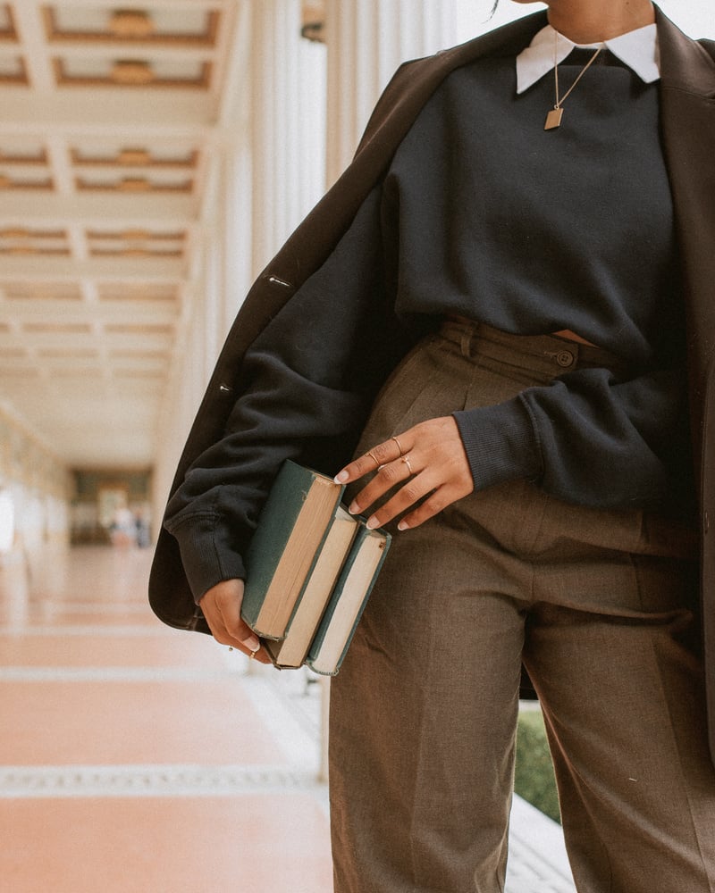 Woman Carrying Books 