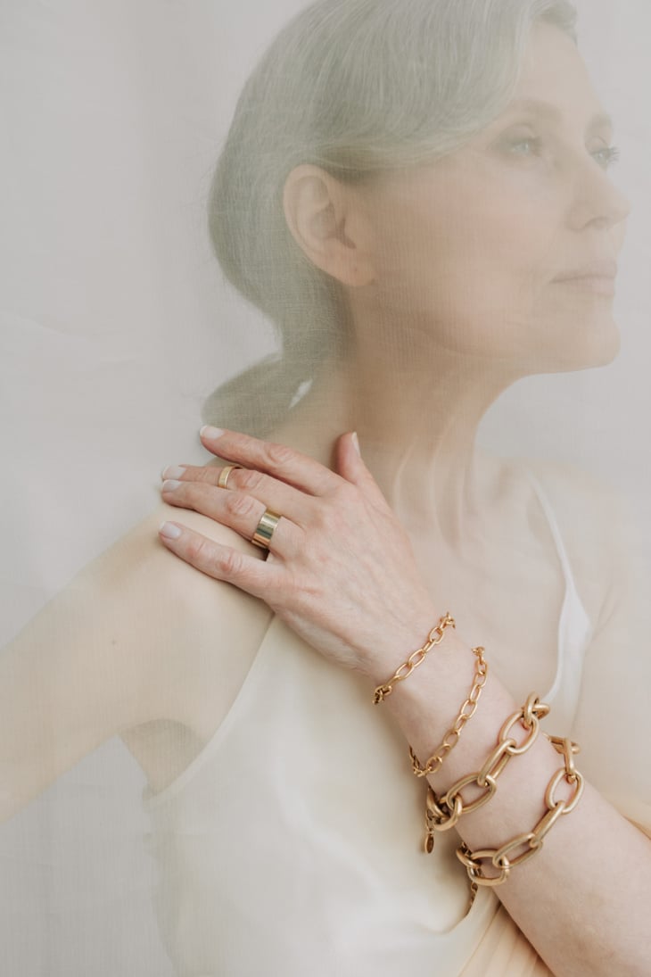 Senior Woman with Gold Bracelets and Ring on Hand