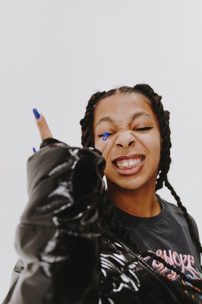 Woman in Oversized Black Leather Jacket and Shirt